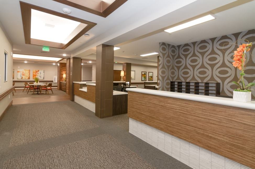 Modern office reception area with stylish interior design and lighting.