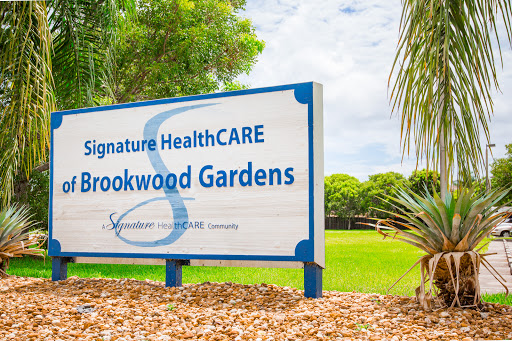 Entrance sign of Signature HealthCARE located at Brookwood Gardens.