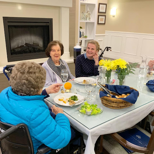 Seniors enjoying a communal meal together in a cozy dining environment.