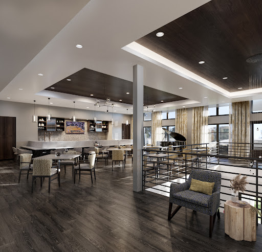 A contemporary lounge area featuring stylish seating arrangements and a well-designed bar.