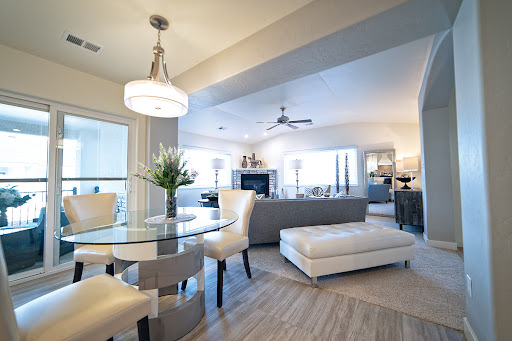 A stylish and modern open-concept living and dining area, featuring contemporary furniture and ample natural light.
