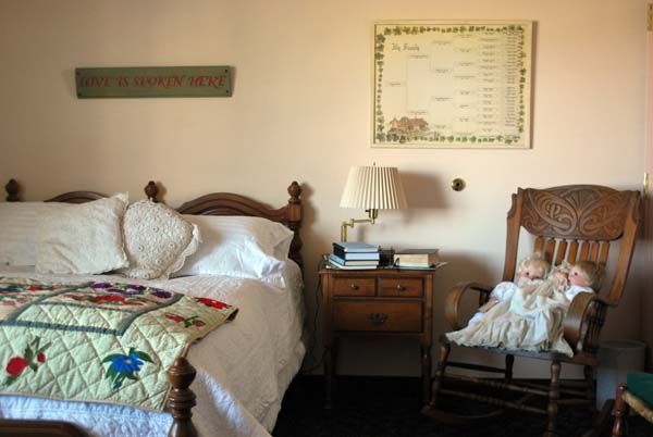 A cozy vintage bedroom with classic furniture and decor.