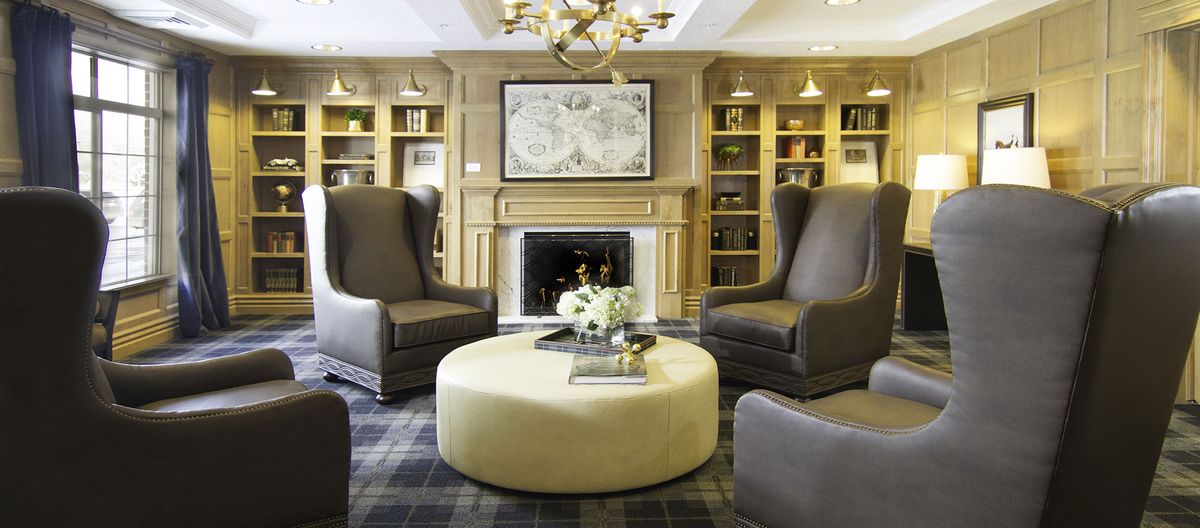 Elegant living room with a central fireplace and comfortable seating.