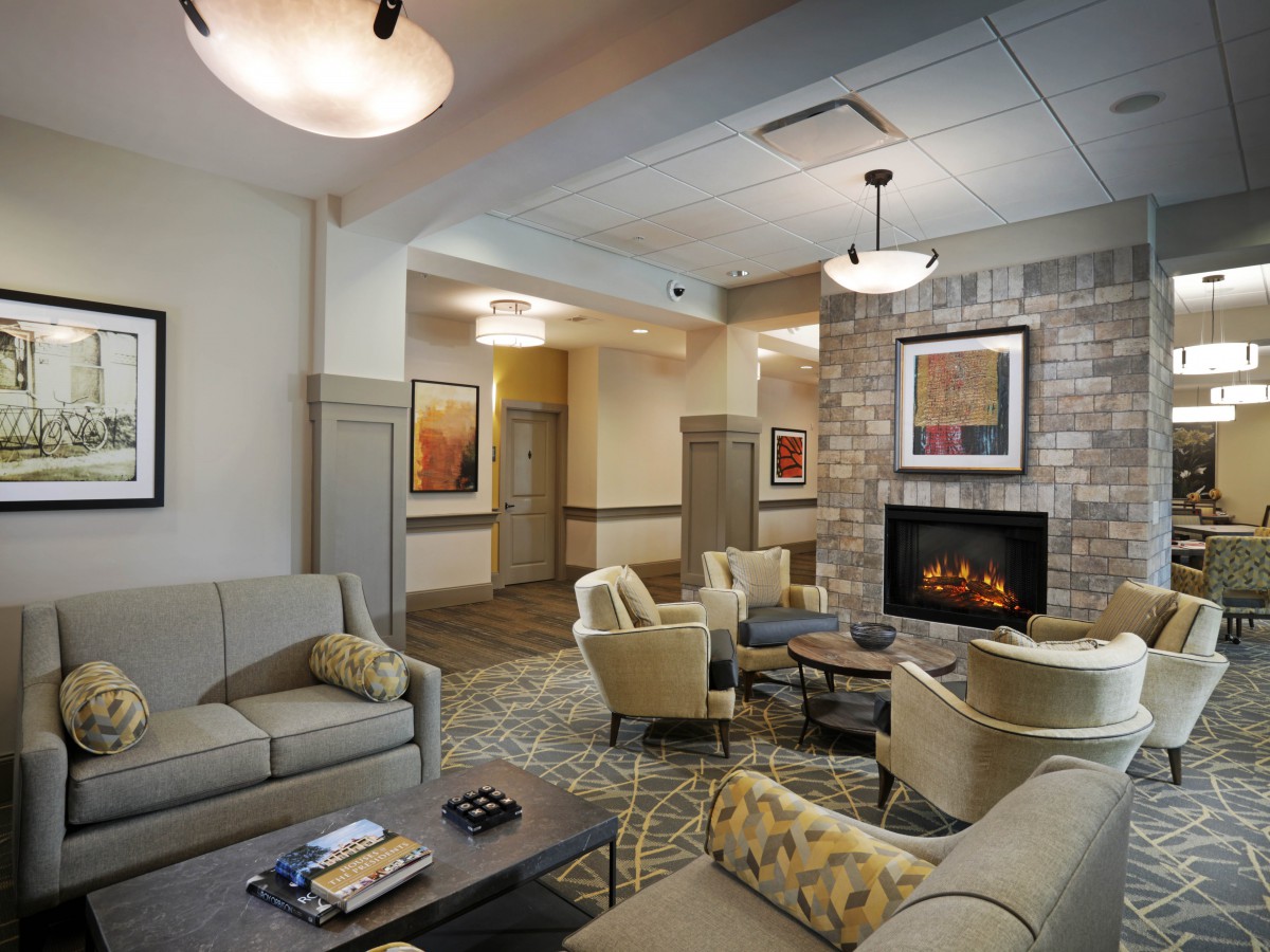 A cozy living room with comfortable seating and a fireplace.