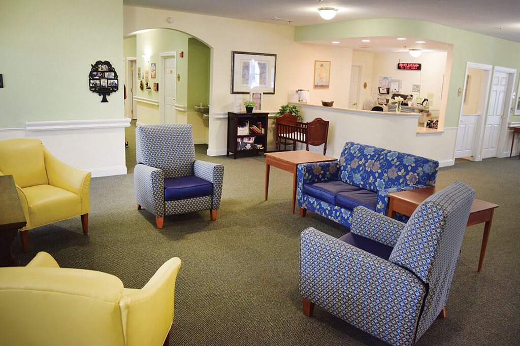 A cozy waiting area with various chairs and a sofa.
