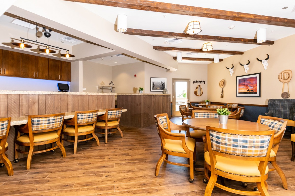 A cozy dining area with wooden furniture and a warm atmosphere.