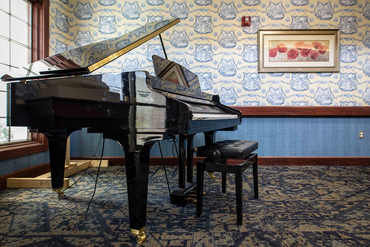 A grand piano in a beautifully decorated music room.