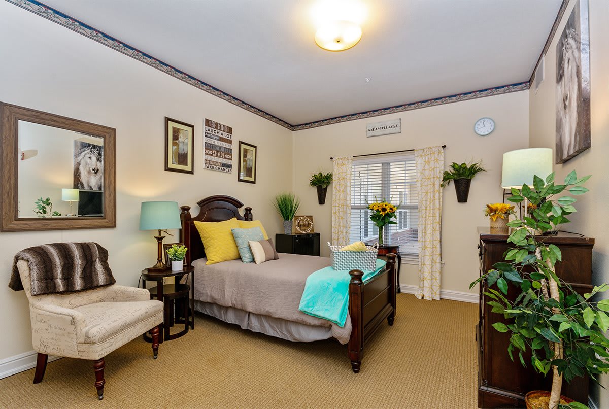 A cozy, well-decorated bedroom with stylish furnishings and decor.