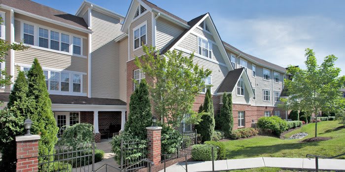 A well-maintained residential apartment building with landscaped surroundings.