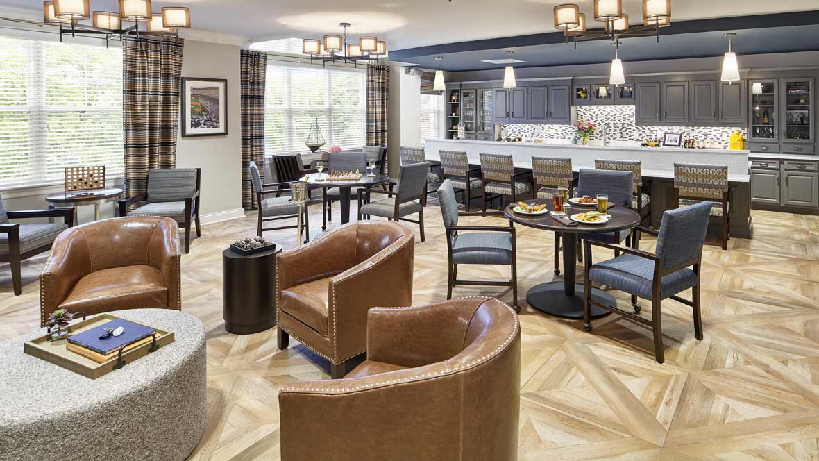 A modern restaurant interior with comfortable seating and a stylish bar area.