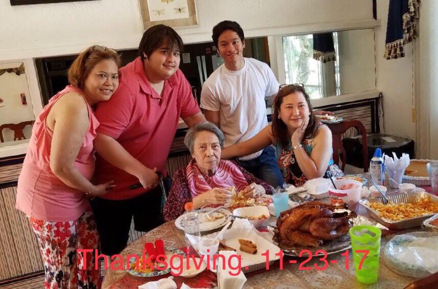 A family gathered around the table for Thanksgiving dinner.