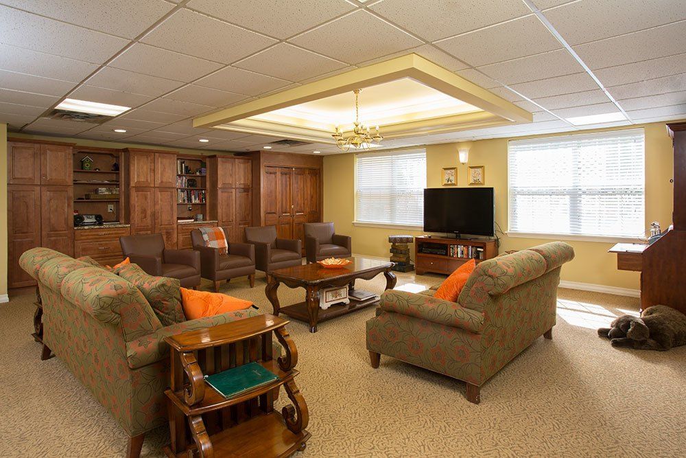 A cozy living room with comfortable sofas, a television, and stylish decor.