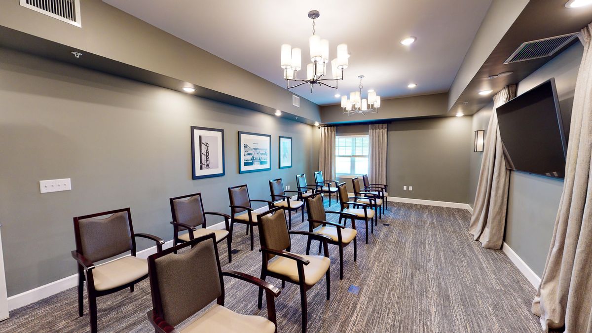 A well-lit conference room with arranged seating and modern decor.