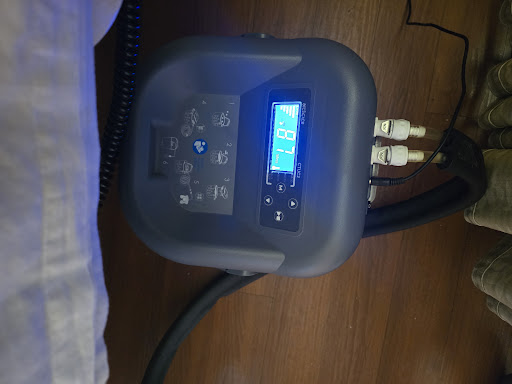 A close-up view of an electronic control panel with a digital display.