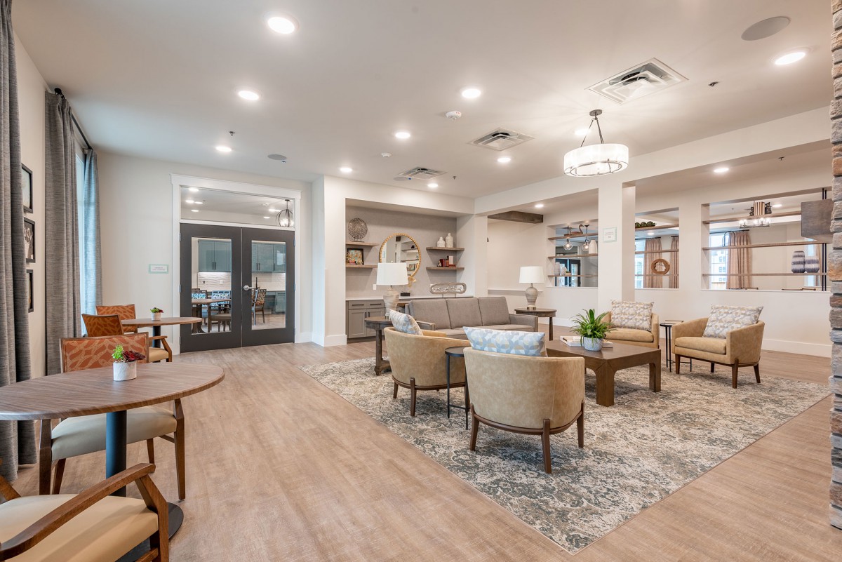 A modern living room with comfortable seating and elegant decor.