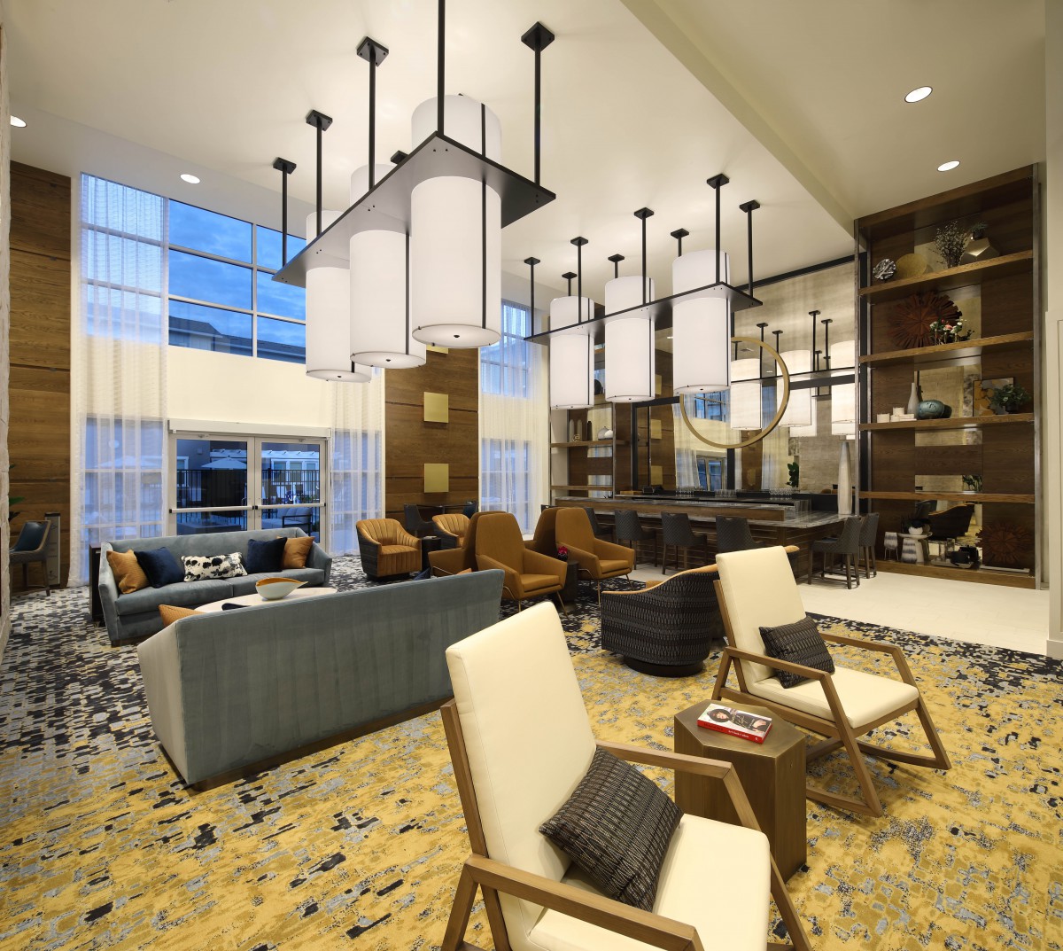 A modern living room with elegant lighting and comfortable seating.