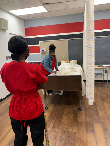 Students engage in a hands-on nursing simulation exercise.