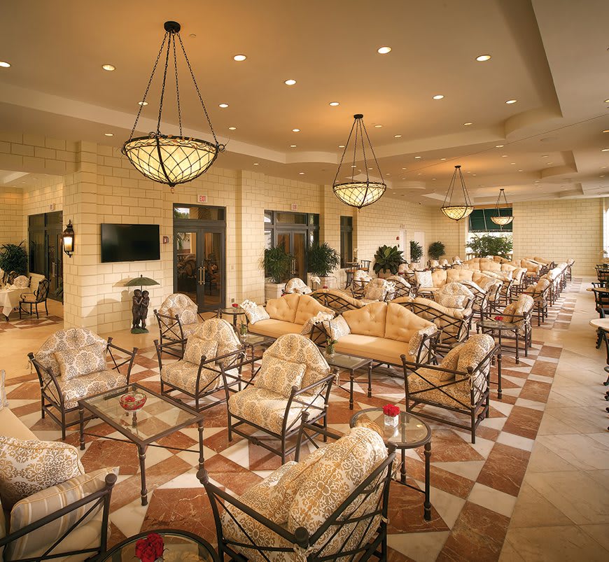 A luxurious indoor lounge with comfortable seating and elegant lighting.