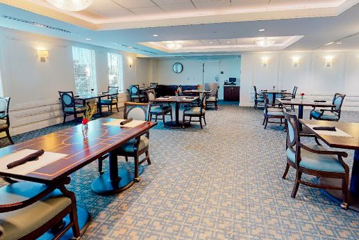 Spacious dining area with neatly arranged tables and chairs.