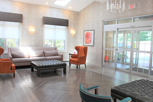 A modern and cozy lobby featuring stylish furniture and a bright atmosphere.