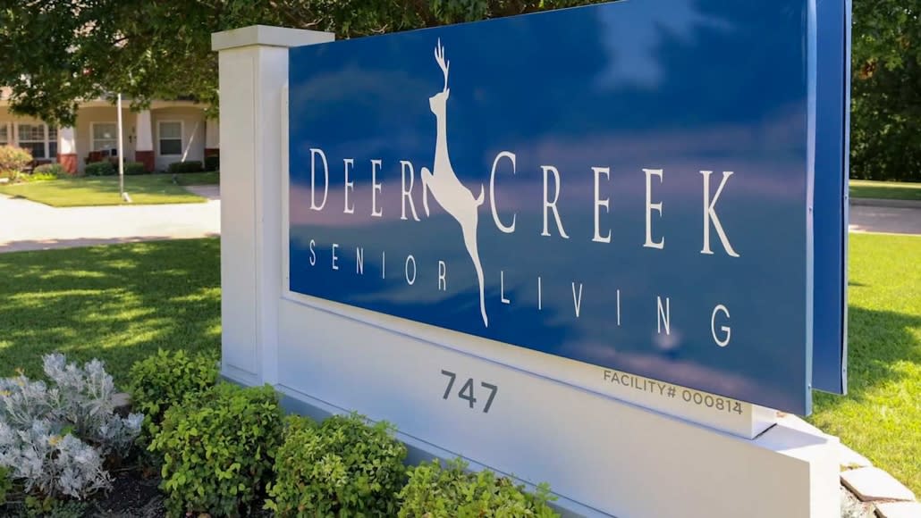 Sign for Deer Creek Senior Living facility.
