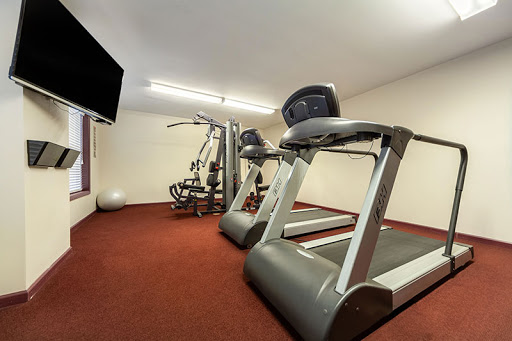 An indoor gym equipped with treadmills and other exercise machines.