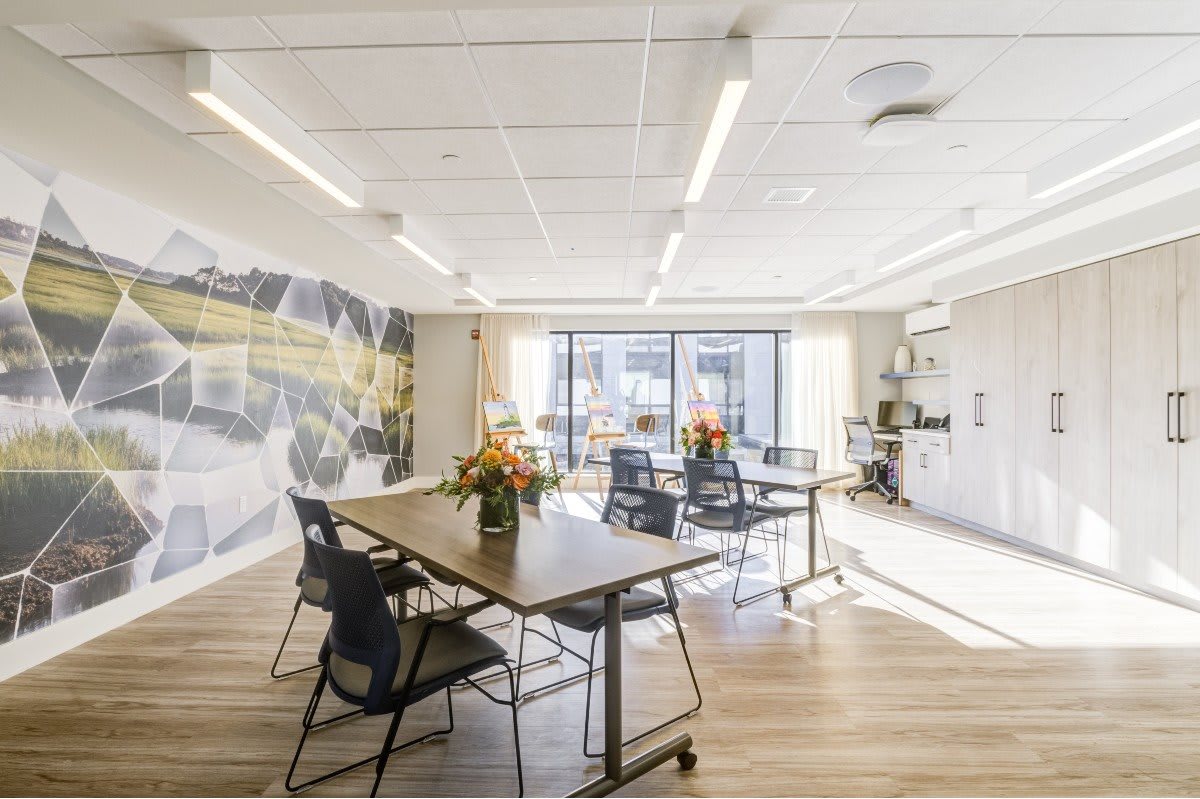 A modern office meeting room with natural lighting and stylish decor.