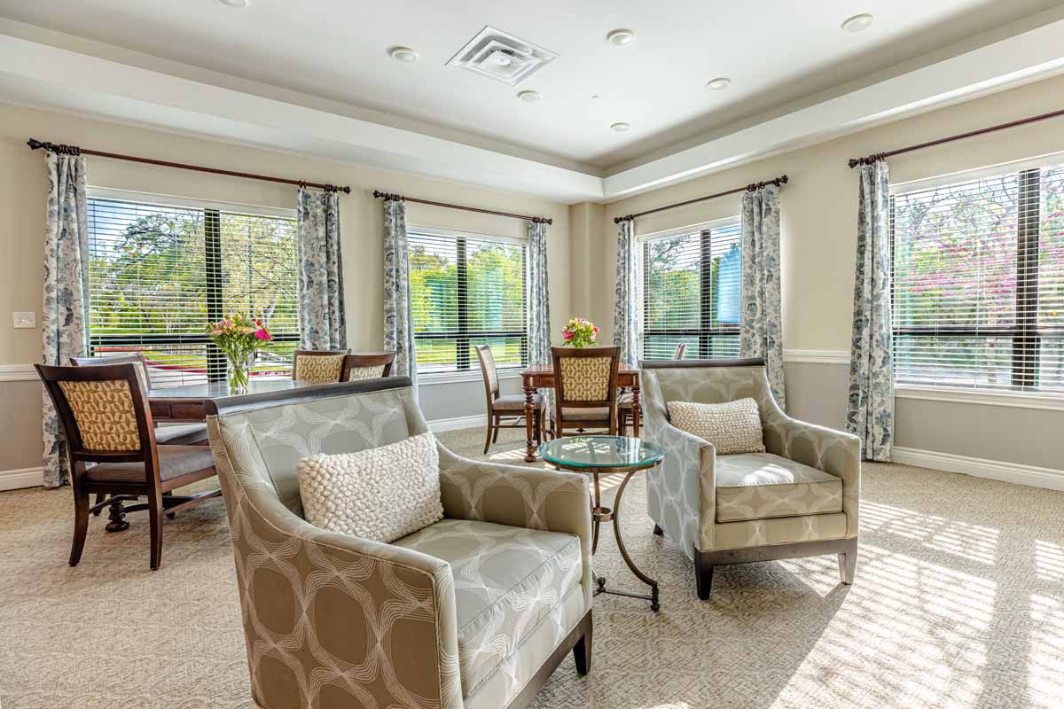 A bright and cozy living room with stylish furniture and large windows letting in natural light.