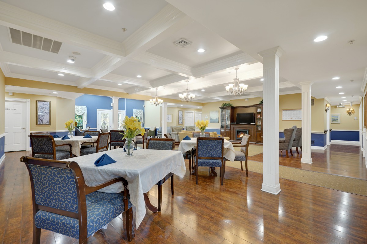 A spacious and well-lit dining area with elegant decor and neatly arranged tables.