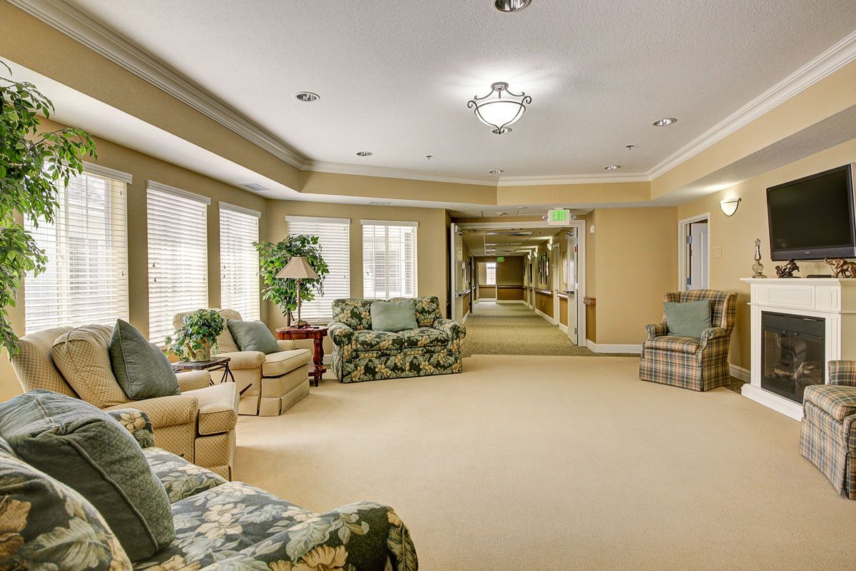 A cozy interior hallway with comfortable seating and large windows.