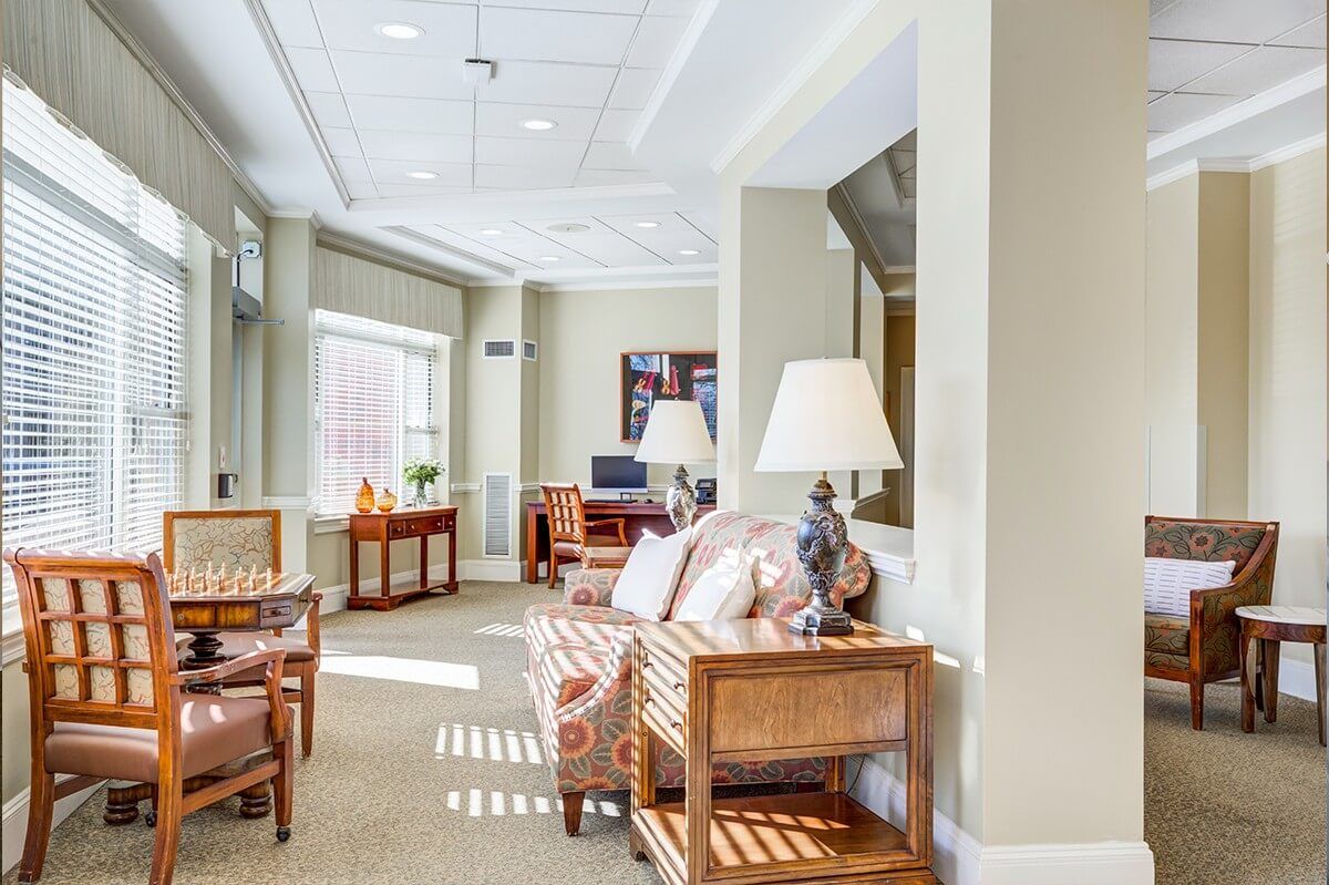 A well-lit living room with comfortable seating and elegant decor.