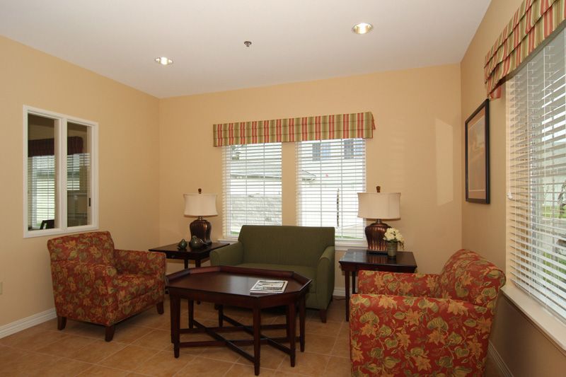 A cozy living room with stylish furniture and warm lighting.