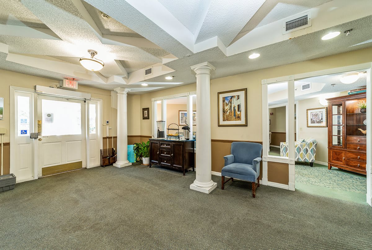 A spacious waiting room with comfortable seating and elegant decor.