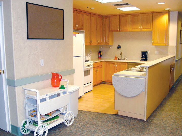 A well-organized kitchen space with wooden cabinets and modern appliances.