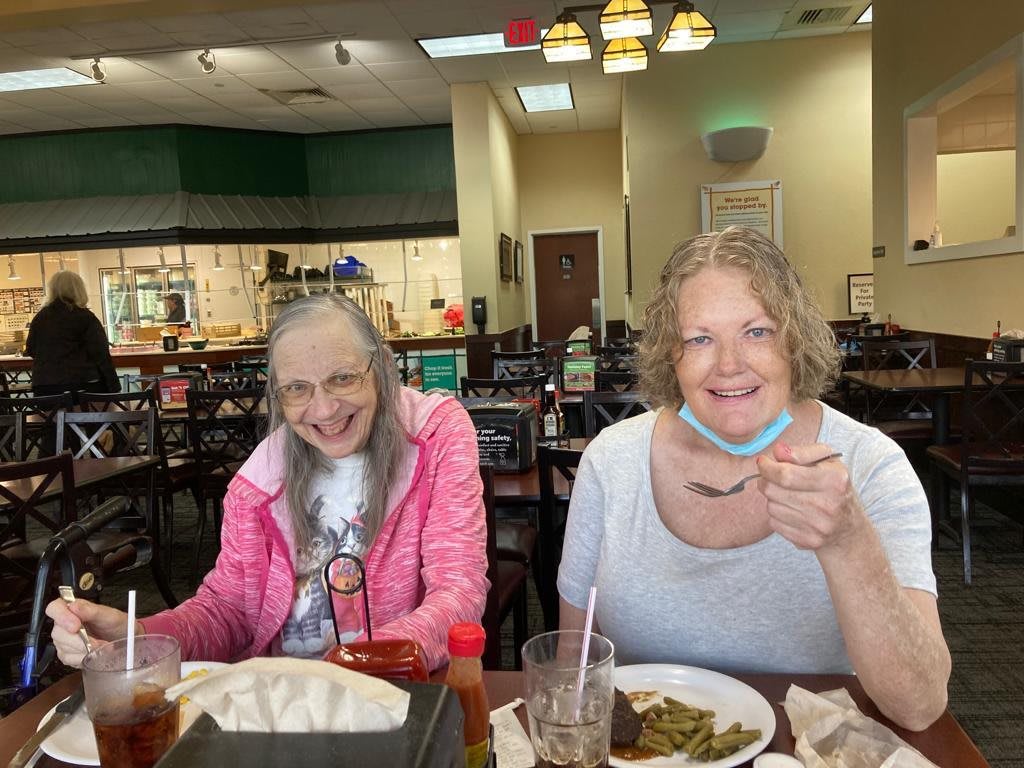 Two people enjoy a meal together at a restaurant.