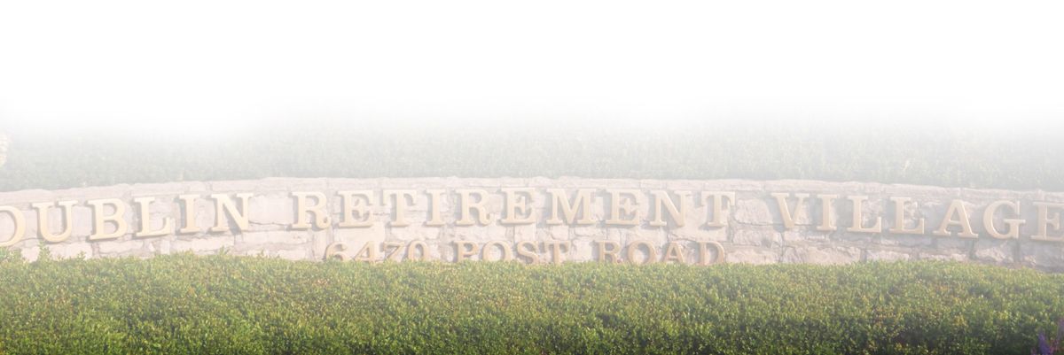 A sign for 'Retirement' partially obscured by fog and surrounded by grass.