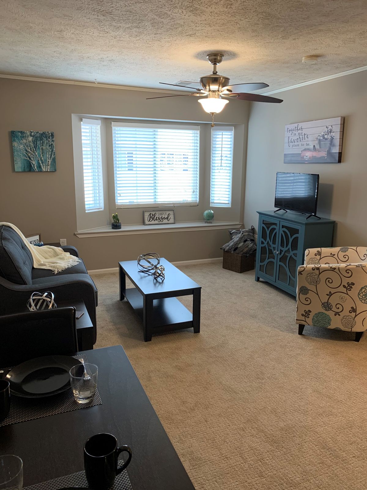 A cozy living room with comfortable seating and natural light.