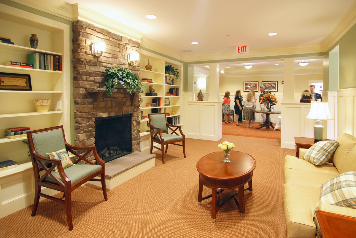 A cozy lobby featuring a fireplace and comfortable seating.