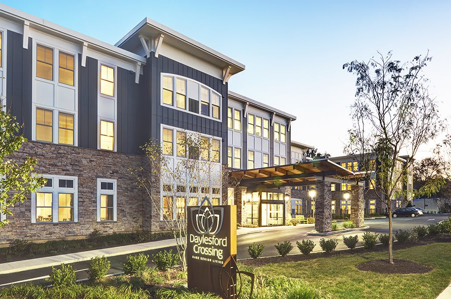 A modern residential building with a well-landscaped exterior.