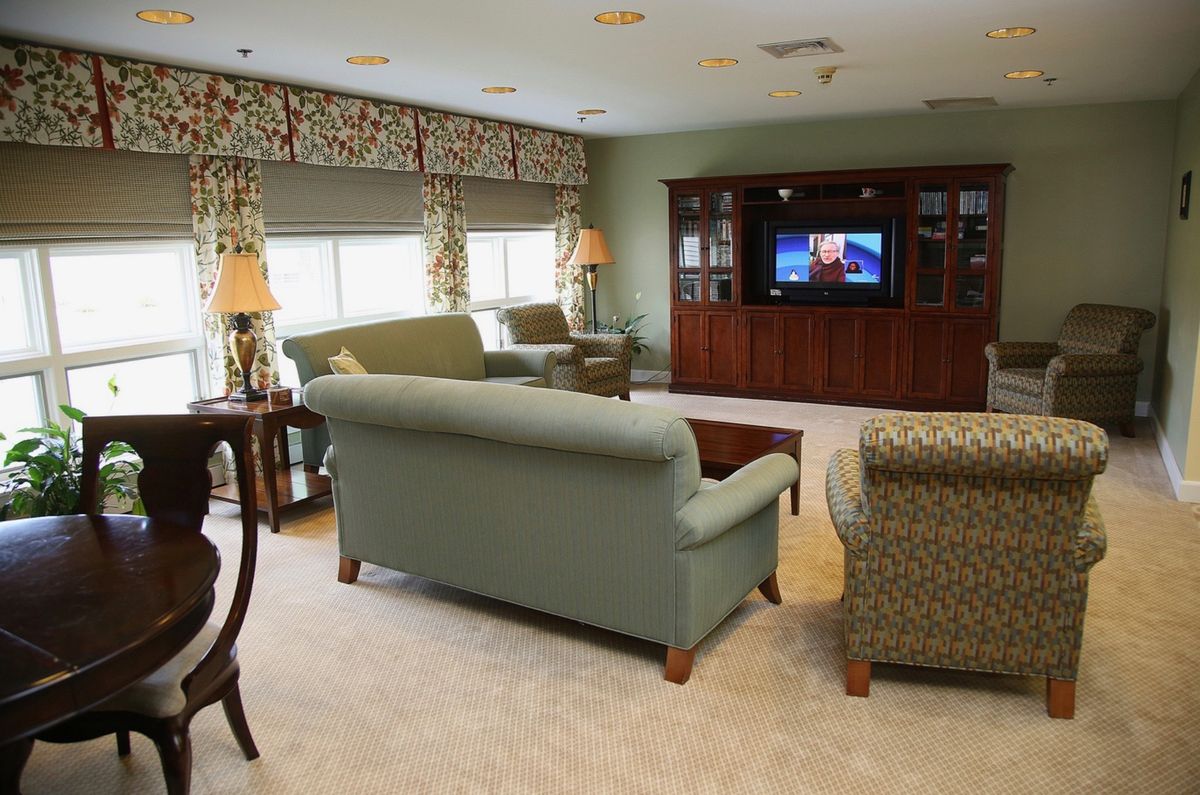 A cozy living room with comfortable sofas, a large television, and tasteful decor.