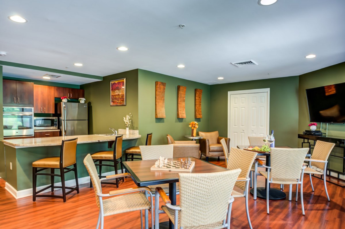 A modern dining and kitchen area with comfortable seating and stylish decor.