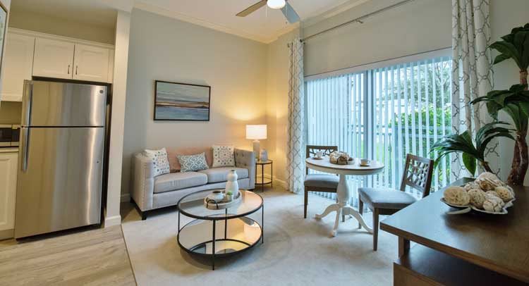 A cozy living room with modern furniture and natural lighting.