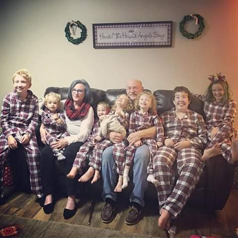 A cozy family gathering in matching pajamas, celebrating the warmth of togetherness.