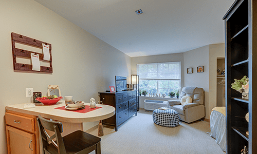 A cozy living room with comfortable seating and natural light.