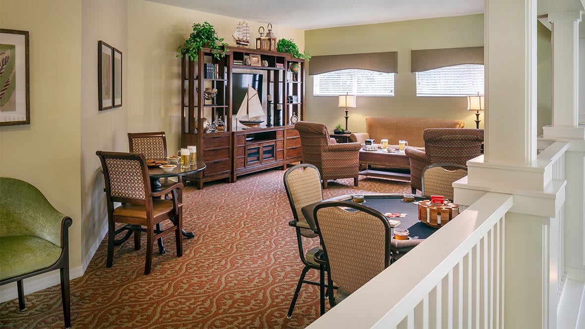 A cozy living room with comfortable seating and elegant decor.