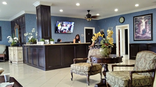 A welcoming lobby with a reception desk, comfortable seating, and modern decor.