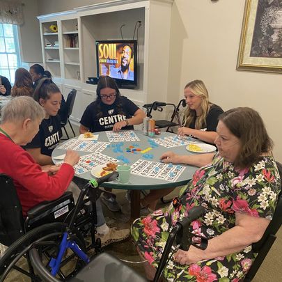Residents enjoying a lively game of bingo together at the community center.