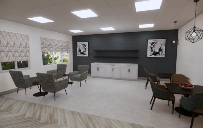 A modern office interior with a minimalist seating area and artwork on the walls.
