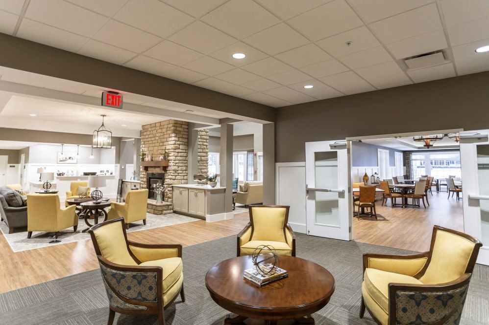 A cozy lounge area with comfortable seating and a round table.