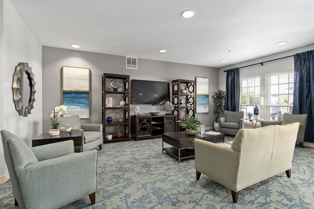 A modern living room with comfortable seating and elegant decor.